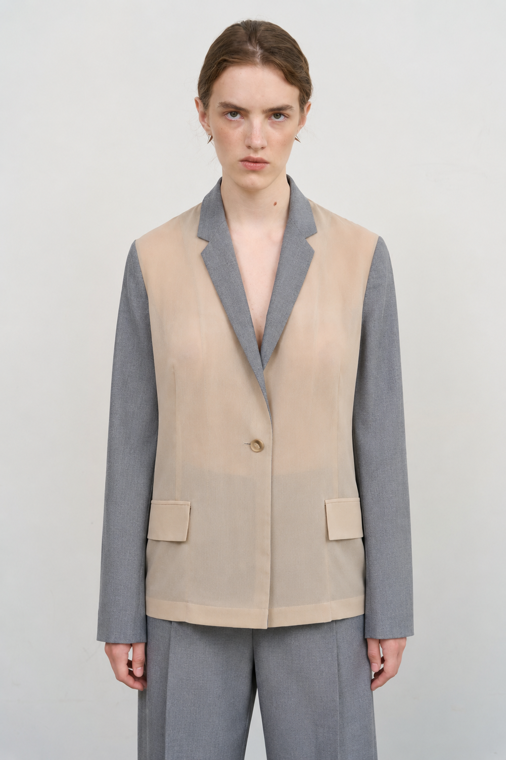 DECONSTRUCTED BOMBER-STYLE CAPE
