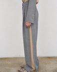PANTS WITH FRAYED-EDGE SIDE STRIPES