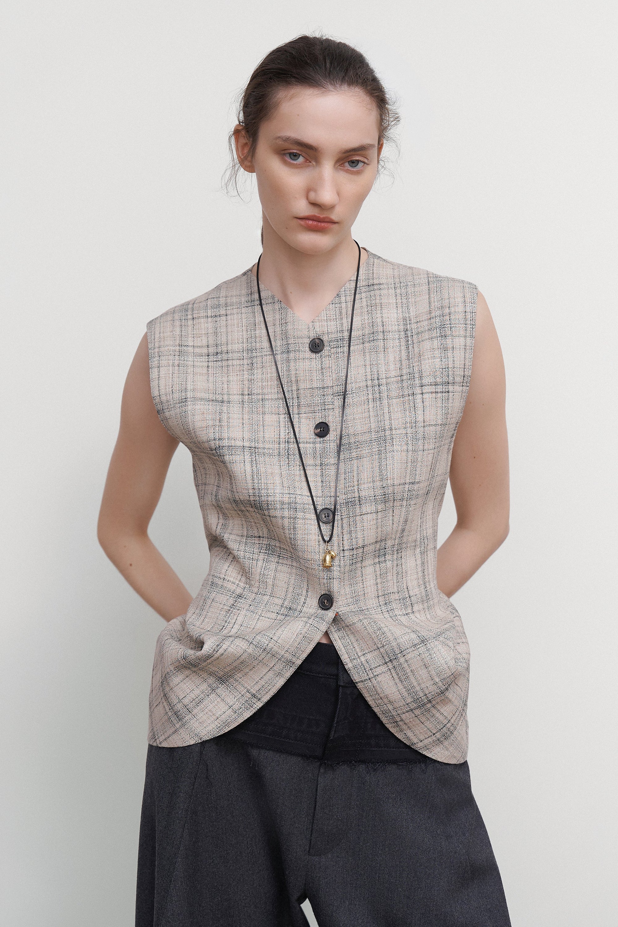 VEST WITH DRAPED SIDES
