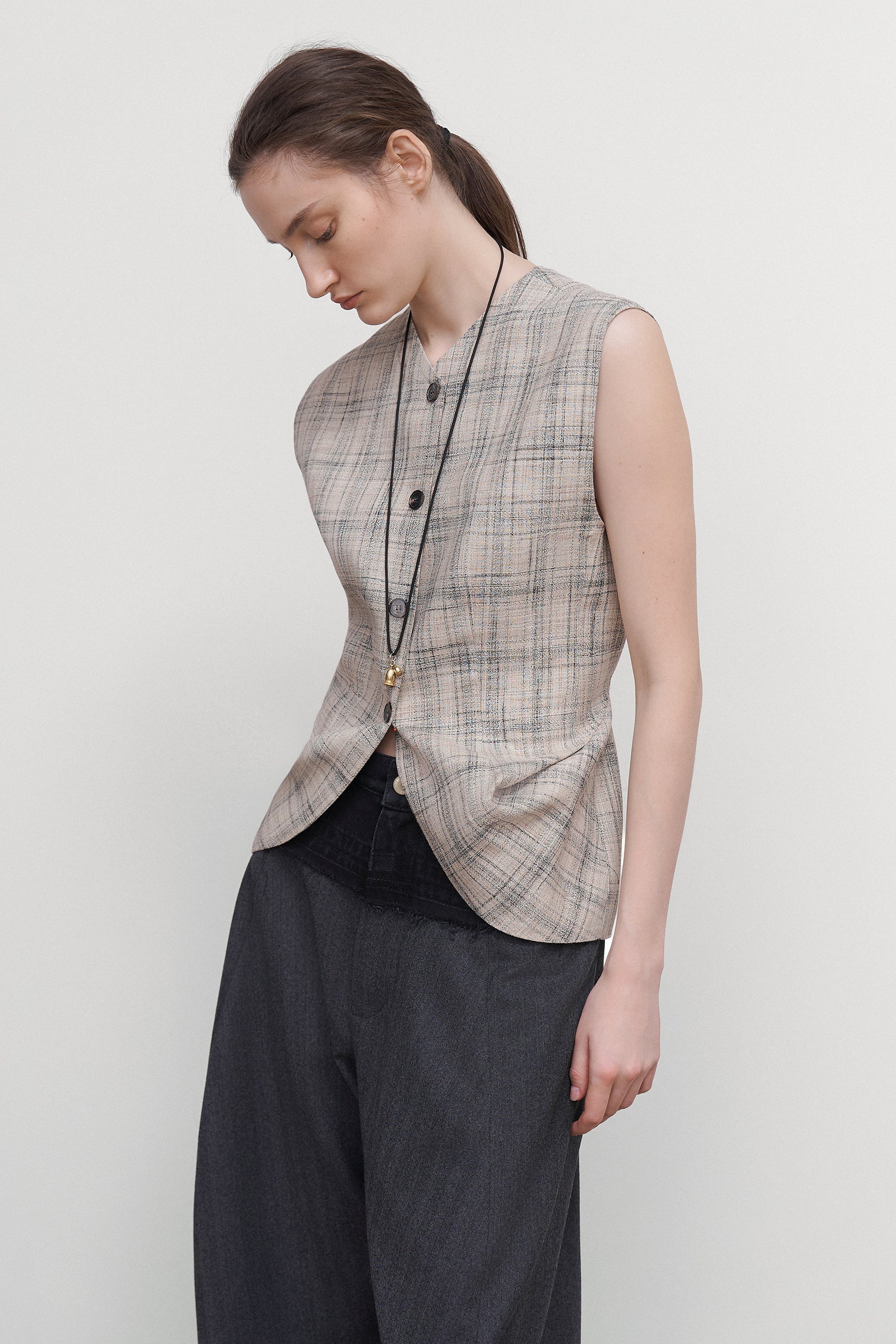 VEST WITH DRAPED SIDES